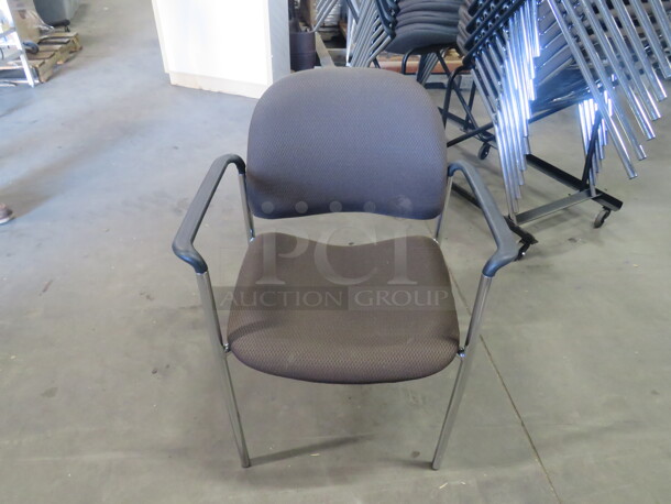 Chrome Arm Chair With Brown Cushioned Seat And Back. 4XBID - Image 1 of 3