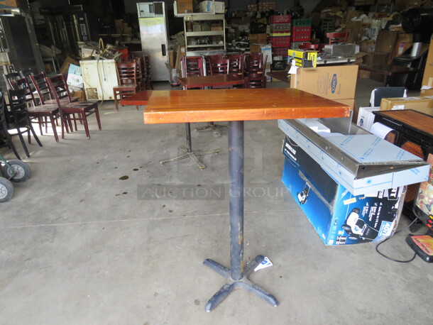 One 1-3/4 Inch Soldi Wooden Table Top On A Bar Height Pedestal Base. 32X24X42.5