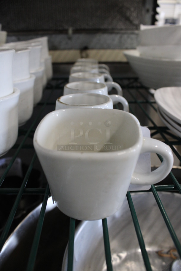 7 White Ceramic Mugs. 3.5x2.5x2. 7 Times Your Bid!