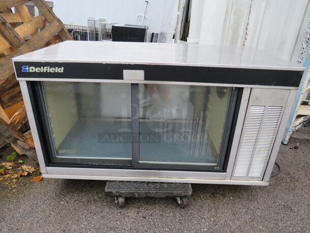 One SS Delfield Refrigerated Display Case. $7048-M. 115 Volt. Working Not Cold. 48X24X24
