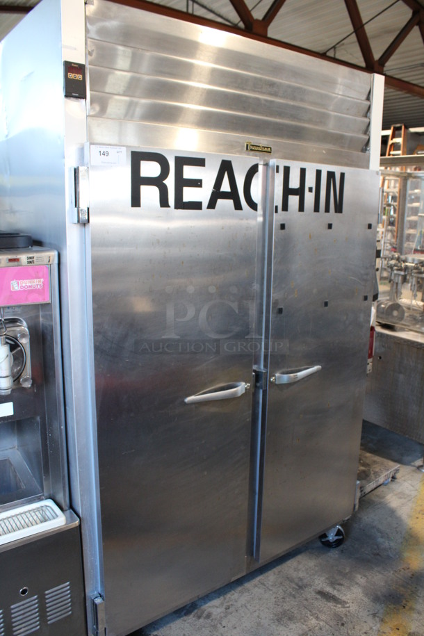 Traulsen Model G22010 Stainless Steel Commercial 2 Door Reach In Freezer w/ Poly Coated Racks on Commercial Casters. 115 Volts, 1 Phase. 52x36x83.5. Tested and Working!