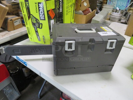 One Ryobi Chainsaw In A Case.
