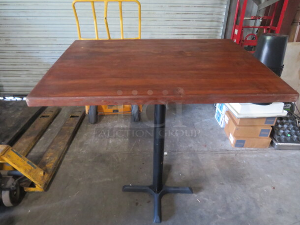 One 1.5 Inch Thick Solid Wood Tabletop On A Bar Height Pedestal Base. 42X30X40
