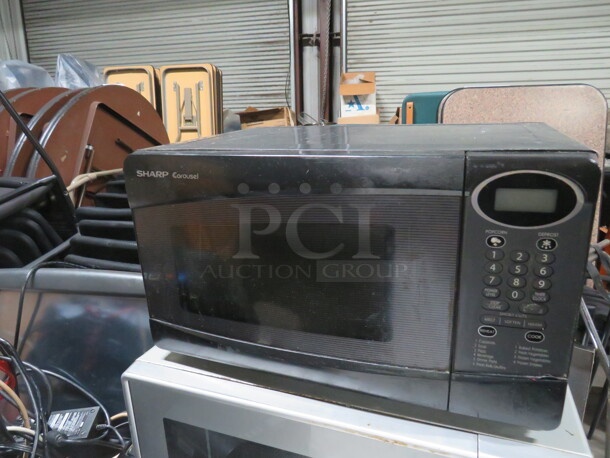 One Sharp Microwave. Model# R-230KK. 120 Volt.  - Image 1 of 2