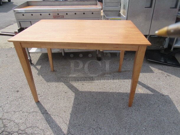 One NEW Wooden Table With Leaf. 54X36X36. 54X54X36. Assembly Required.