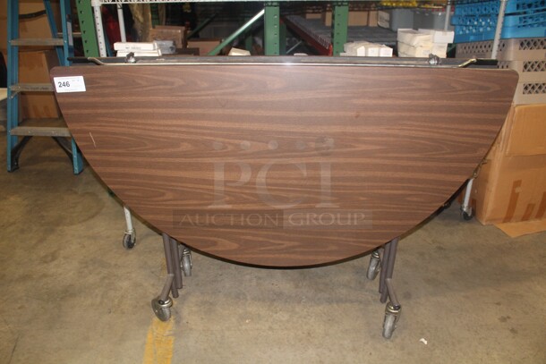 NICE! Round Folding Table On Casters. 60x39
