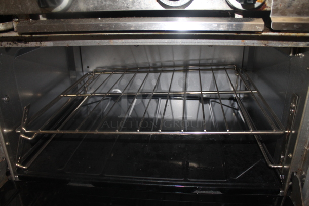 Garland SunFire Stainless Steel Commercial Natural Gas Powered 6 Burner Range w/ Right Side Flat Top Griddle, 2 Ovens, Over Shelf and Back Splash. - Image 6 of 6