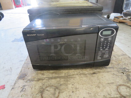 One Sharp Carousel Microwave. Model# R-209KK-W. 120 Volt. 18X13X11