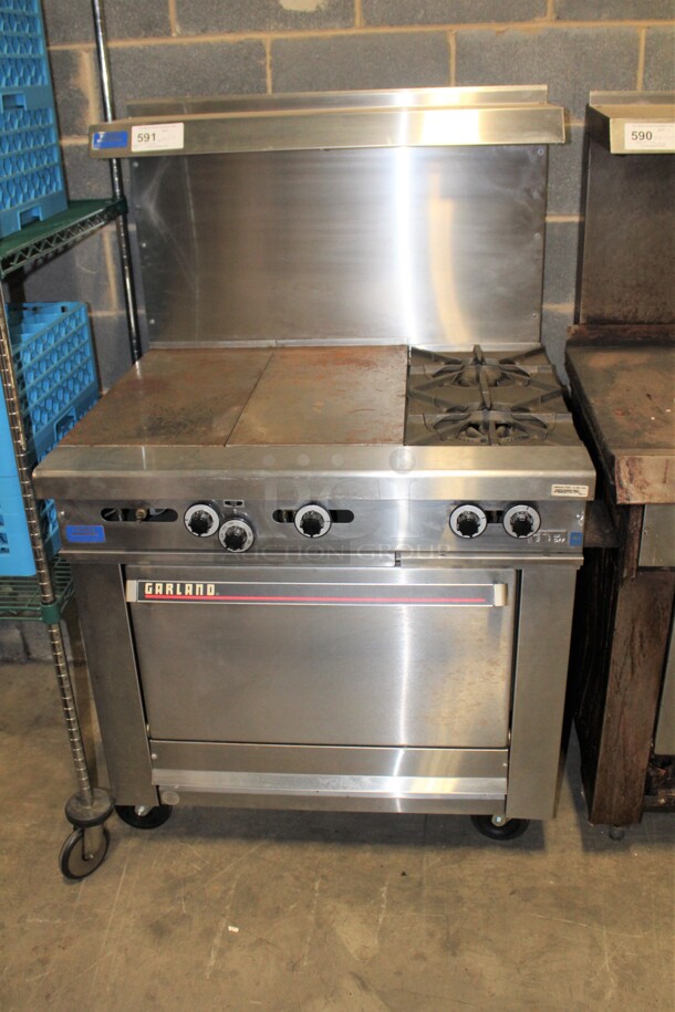 TERRIFIC! Garland 2 Burner Natural Gas Range With Full Size Oven, Griddle, Backsplash And Salamander Shelf On Casters! 36x34x59. Working When Pulled! 