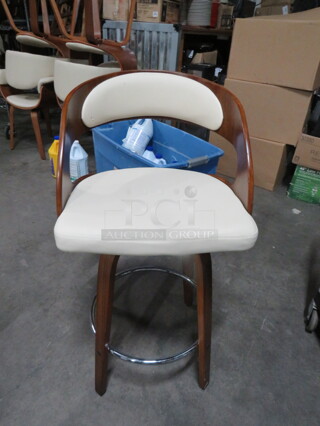 One Wooden Counter Height Arm Chair With Beige Cushioned Seat And Back.