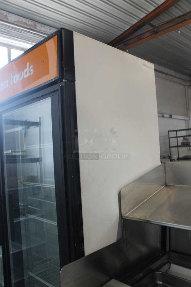 2011 True GDM-49F ENERGY STAR Metal Commercial 2 Door Reach In Freezer Merchandiser w/ Poly Coated Racks on Commercial Casters. 115/208-230 Volts, 1 Phase.  - Image 7 of 8