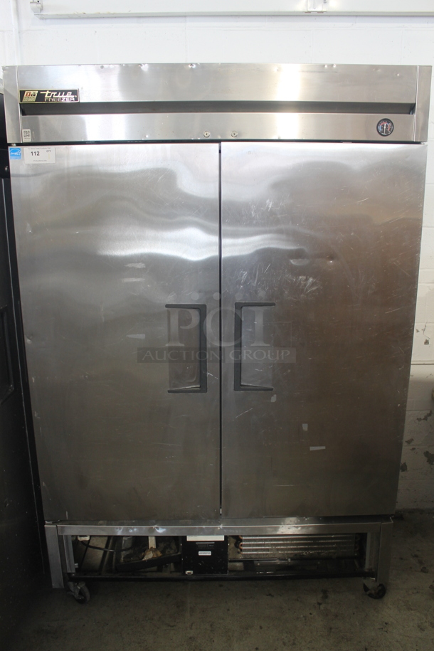 2013 True T-49F Commercial Stainless Steel Two Door Reach In Freezer With Polycoated Racks on Commercial Casters. 115V, 1 Phase. Tested and Working!