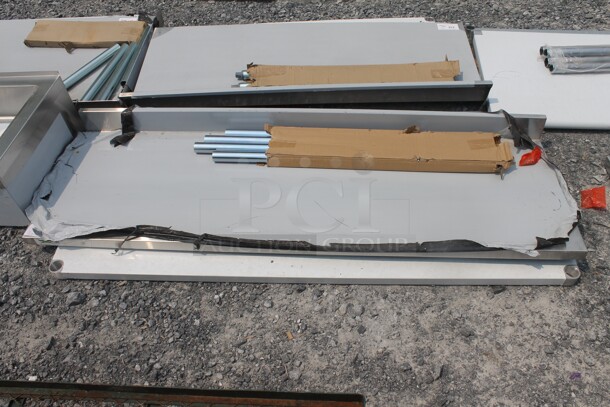 BRAND NEW SCRATCH AND DENT! Regency 600TB2472G Commercial Stainless Steel Disassembled Work Table With Undershelf And Galvanized Legs - Image 1 of 4