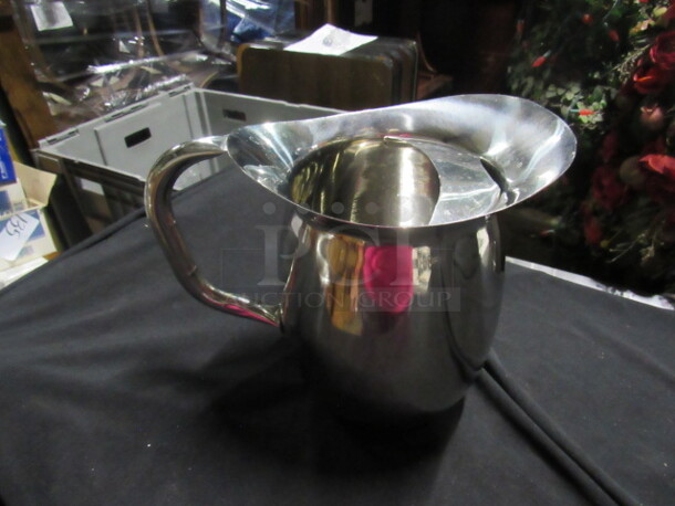 One Stainless Water Pitcher.
