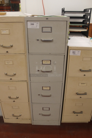 Gray Metal 4 Drawer Filing Cabinet w/ Contents. BUYER MUST REMOVE.