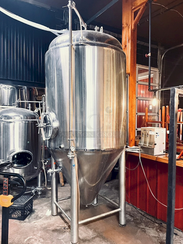 ? ?  BEAUTIFUL!! Stout Tanks & Kettles - 15 BBL Fermenter / Unitank (Jacketed). ? ?                 Features: Easily Converts to a Unitank or Brite Serving Tank;
Glycol Jacketed - 2 Zones: Cone and Sidewall; 
Shadowless Manway for Easy Cleaning;
Adjustable Racking Arm for Clear Transfer;
1.5" Sample Valve for Quality Testing;
Back Mounted Pressure Gauge;
Adjustable Feet for Leveling on Uneven Floors or Fine Height Adjustments;
Pressure Gauge Type:  Back Mount;
CIP Arm and 2.5" Rotating CIP Spray Ball;
2 Butterfly Valves;
Rated to 2-Bar (29 PSI);
1/2" NPT Welded Thermowell for Contactless Temperature Probe
Tank Thickness: 3mm
Jacket and Outer Shell Thickness: 2mm.
Cone: 60 degree Interior Angle.
51.5-in. diameter x 125-in.H. - Image 5 of 8