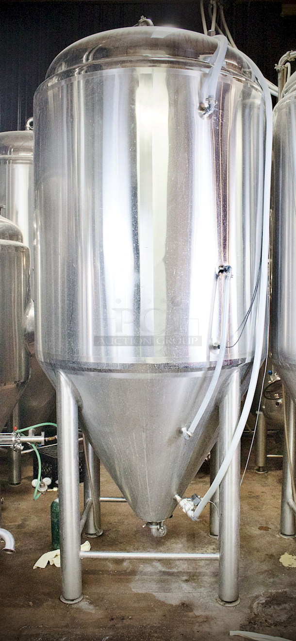 ? ? BEAUTIFUL!! Stout Tanks & Kettles - 15 BBL Fermenter / Unitank (Jacketed). ? ? Features: Easily Converts to a Unitank or Brite Serving Tank; Glycol Jacketed - 2 Zones: Cone and Sidewall; Shadowless Manway for Easy Cleaning; Adjustable Racking Arm for Clear Transfer; 1.5" Sample Valve for Quality Testing; Back Mounted Pressure Gauge; Adjustable Feet for Leveling on Uneven Floors or Fine Height Adjustments; Pressure Gauge Type: Back Mount; CIP Arm and 2.5" Rotating CIP Spray Ball; 2 Butterfly Valves; Rated to 2-Bar (29 PSI); 1/2" NPT Welded Thermowell for Contactless Temperature Probe Tank Thickness: 3mm Jacket and Outer Shell Thickness: 2mm. Cone: 60 degree Interior Angle. 51.5-in. diameter x 125-in.H. - Image 8 of 8