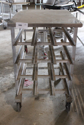 LIKE NEW!! New Age Industrial 1226 Half-Height Mobile Can Storage Rack, On Commercial Casters, Sloped glides for automatic can retrieval, On Commercial Casters, Holds (72) #10 cans or (96) #5 cans. 
25-1/2x35x41