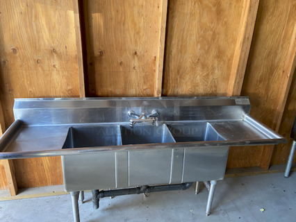 BEAUTIFUL! Advance Tabco FC-3-1515-15RL Three Compartment Stainless Steel Commercial Sink with Two Drainboards. Includes Sink and Plumbing - 75" Overall Dimensions:
Left to Right: 75"
Front to Back: 21"
Height: 43"

Compartment Dimensions:
Left to Right: 15"
Front to Back: 15"
Depth: 14"
