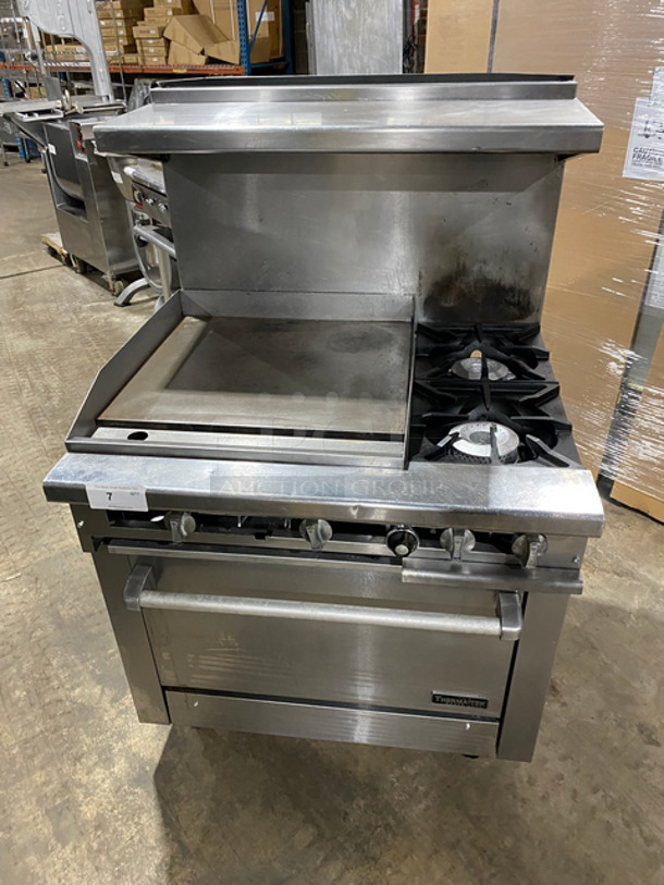 AMAZING! Therma Tek Commercial Natural Gas Powered Flat Top Griddle! With Right Side 2 Burners! Griddle Has Side Splashes! Raised Backsplash And Salamander Shelf! With Oven Underneath! Metal Oven Rack! All Stainless Steel! On Casters!