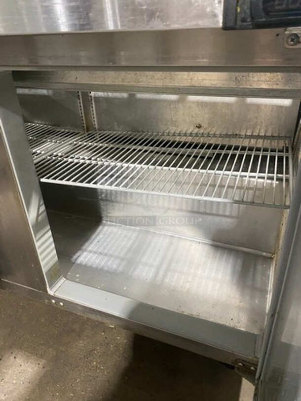 Continental Commercial Refrigerated Sandwich Prep Table! With Double Over Head Shelf! With 2 Door Underneath Storage Space! With Poly Coated Racks! All Stainless Steel! Model: SW6024M Serial 15713729! 115V 1Phase! On Casters!
 - Image 6 of 10