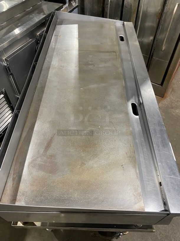NICE! Garland Heavy Duty Commercial Countertop Gas Powered Flat Griddle! 1-Inch-Thick Plate! With Back And Side Splashes! On Equipment Stand! With Storage Space Underneath! All Stainless Steel! Model GTGG72G72M Serial 1303100100266! On Casters! WORKING WHEN REMOVED! - Image 5 of 9