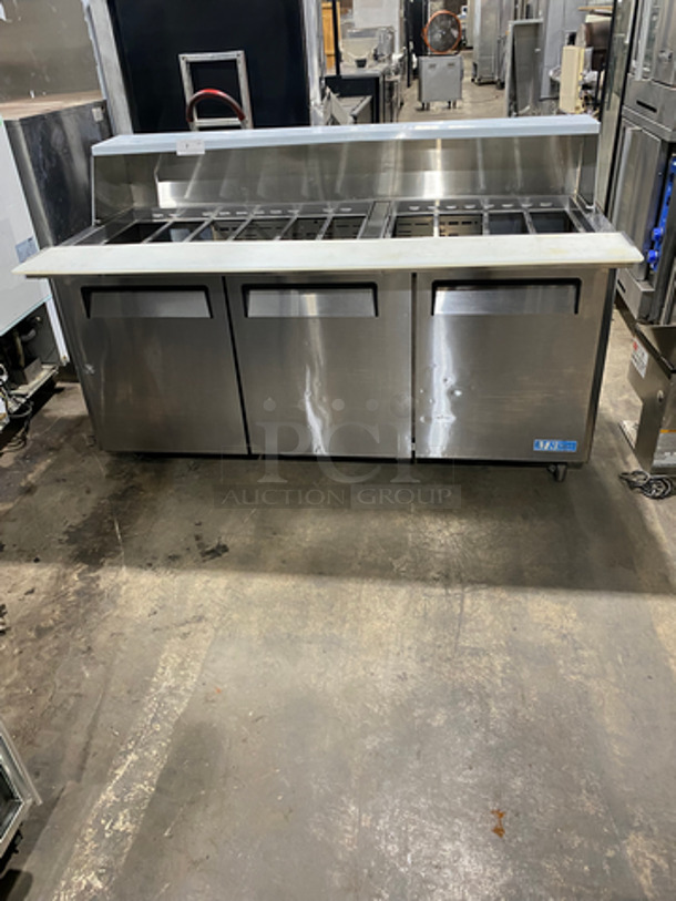 Turbo Air Commercial Refrigerated Sandwich Prep Table! With Commercial Cutting Board! With 3 Door Storage Space Underneath! Poly Coated Racks! All Stainless Steel! On Casters! Model: MST7230 SN: MM7T710082 115V 60HZ 1 Phase