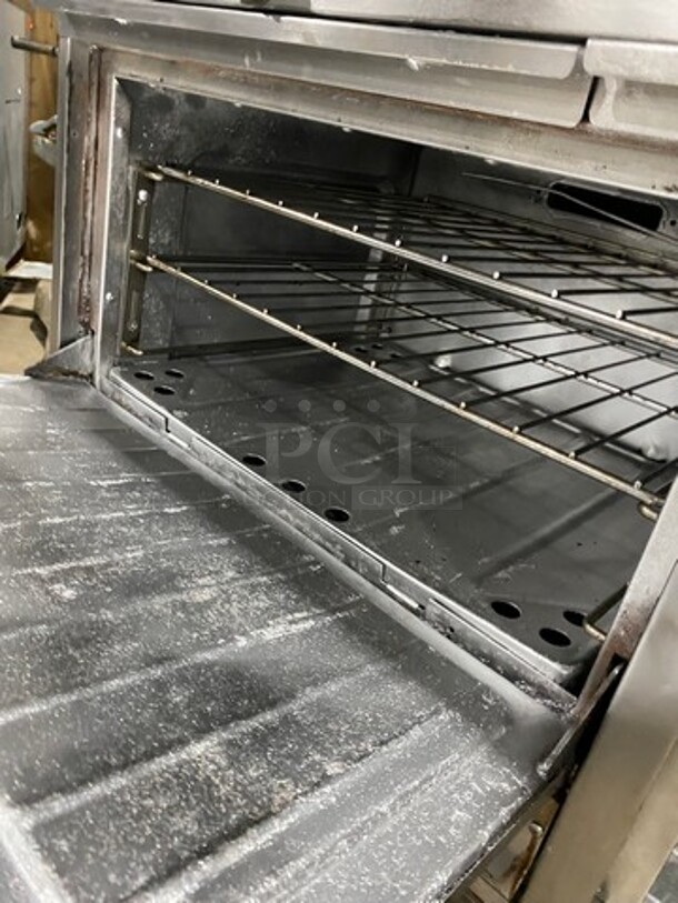 Garland Commercial Gas Powered 8 Burner Stove! With Raised Back Splash And Salamander! With Oven Underneath! All Stainless Steel! On Casters! - Image 9 of 12