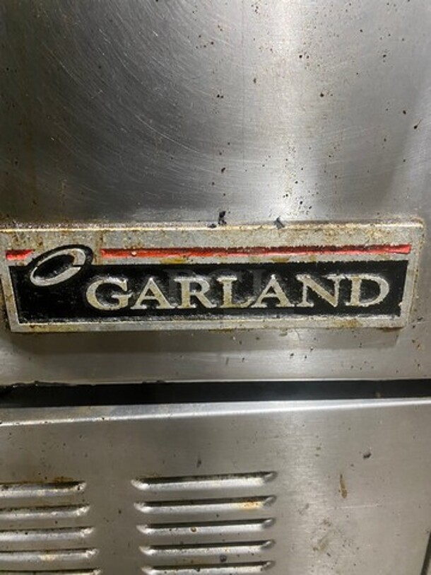 Garland Commercial Natural Gas Powered 6 Burner Stove! With Raised Backsplash & Overhead Salamander Shelf! With Convection Oven Underneath! All Stainless Steel! Model H286RC Serial 0303RG0779! On Casters! WORKING WHEN REMOVED! - Image 7 of 12