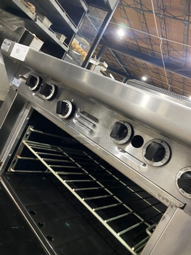 Garland Commercial Natural Gas Powered 4 Burner Stove! With Back Splash! With Oven Underneath! Metal Oven Rack! All Stainless Steel! On Casters! Model: M44R SN: 1601100100589 - Image 8 of 10