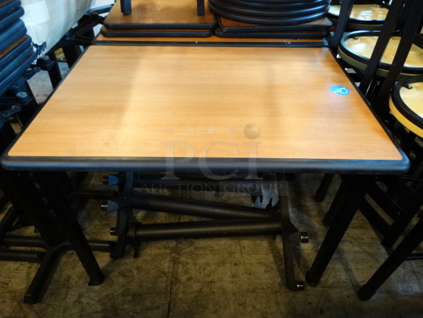 Wood Pattern Wheelchair Accessible Table on 4 Black Metal Table Legs. Stock Picture - Cosmetic Condition May Vary. 42x30x30