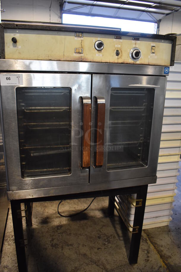 Stainless Steel Commercial Electric Powered Full Size Convection Oven w/ View Through Doors and Metal Oven Racks on Metal Legs. 230 Volts. 36x32x62