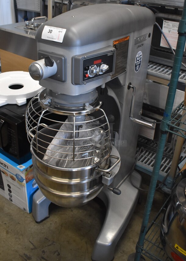 BRAND NEW SCRATCH AND DENT! Hobart Legacy HL300 Metal Commercial Floor Style 30 Quart Planetary Dough Mixer w/ Stainless Steel Mixing Bowl, Bowl Guard, Whisk, Paddle and Dough Hook Attachments. Consignor Has Stated That This Unit Has Transmission Issues. 100-120 Volts, 1 Phase. 23x30x50