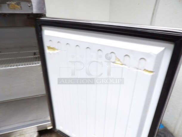 Maxx Cold, 2-Door Freezer Stainless Prep Table W/Moderate Wear. TESTED AND WORKING. 

Small Sections of Plastic on Inside of Doors Cracked/Missing and Dents/Scuffs to Inner Compartment. Missing One Castor and One Other Needs Reattached or Repaired. 

48.5"x30.25"x37.5" - Image 5 of 6