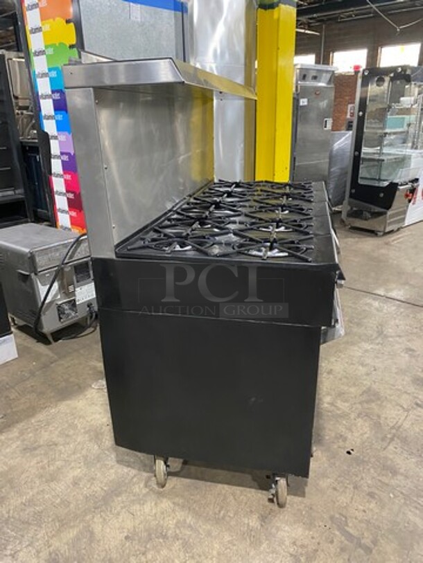 AMAZING FIND! Garland Natural Gas Powered 10 Burner Stove! With 2 Full-Sized Ovens! With Metal Oven Racks! With Raised Back Splash & Salamander Shelf! Stainless Steel! On Casters! - Image 3 of 11