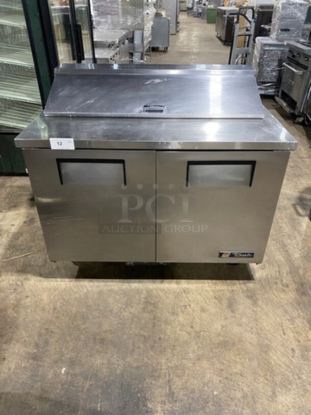 True Commercial Refrigerated Sandwich Prep Table! With 2 Door Underneath Storage Space! Poly Coated Racks! All Stainless Steel! On Casters! Model: TSSU4812 SN: 14045588 115V 60HZ 1 Phase