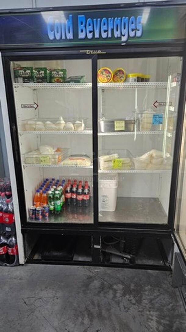 True GDM-47 54 1/8" Refrigerated Sliding Glass Door Merchandiser. Contents inside not included. - Image 1 of 3