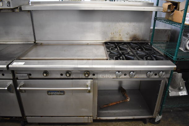 Imperial Stainless Steel Commercial Natural Gas Powered 4 Burner Range, Flat Top Griddle, Oven, Over Shelf and Back Splash on Commercial Casters. 60x31x57
