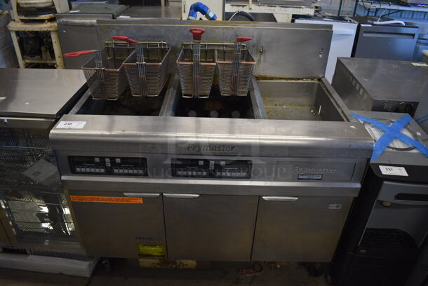 2011 Frymaster FMPH255CSE Stainless Steel Commercial Propane Gas Powered 2 Bay Deep Fat Fryer w/ 4 Metal Fry Baskets and Right Side Dumping Station on Commercial Casters. 80,000 BTU. 47x30x47