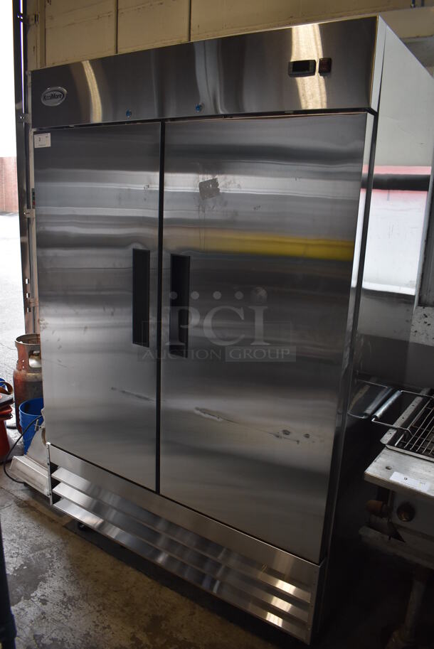 BRAND NEW SCRATCH AND DENT! KoolMore RIR-2D-SS Stainless Steel Commercial 2 Door Reach In Cooler w/ Poly Coated Racks on Commercial Casters. 115 Volts, 1 Phase. 54x32.5x83. Tested and Working! - Image 1 of 8