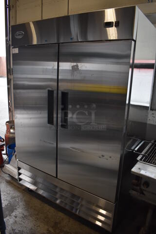 BRAND NEW SCRATCH AND DENT! KoolMore RIR-2D-SS Stainless Steel Commercial 2 Door Reach In Cooler w/ Poly Coated Racks on Commercial Casters. 115 Volts, 1 Phase. 54x32.5x83. Tested and Working!
