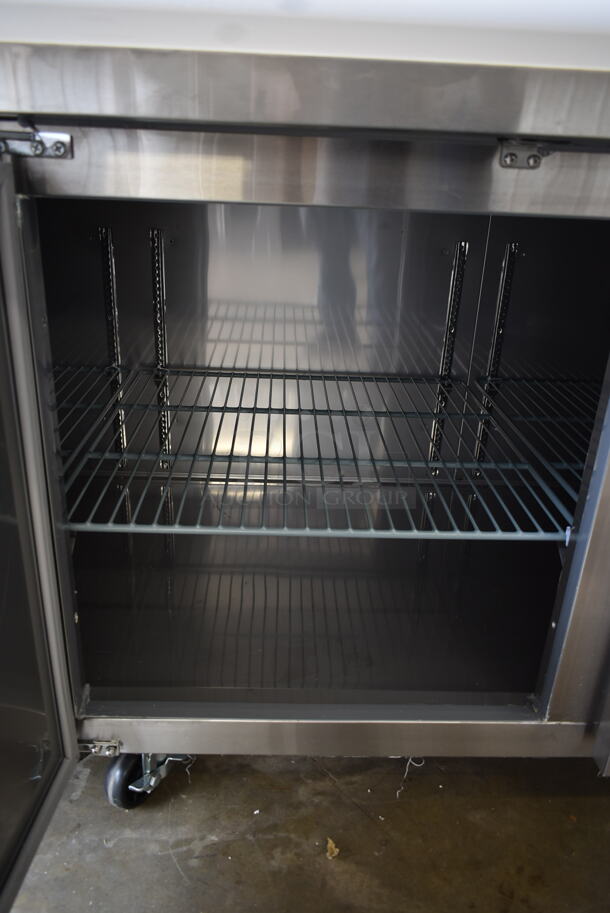 BRAND NEW SCRATCH AND DENT! 2023 Avantco 178SSPPT3 Stainless Steel Commercial Refrigerated Pizza Prep Table on Commercial Casters. 115 Volts, 1 Phase. Tested and Working! - Image 10 of 12