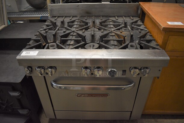Southbend Model 4361A Stainless Steel Commercial Natural Gas Powered 6 Burner Range w/ Oven on Commercial Casters. 36.5x34x40