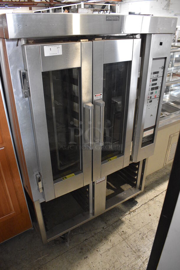 Stainless Steel Commercial Gas Powered Mini Rotating Rack Oven w/ View Through Doors and Lower Pan Rack on Commercial Casters. 48x36x75. Picture of the Unit Powered On Before Removal Is Included In the Listing.