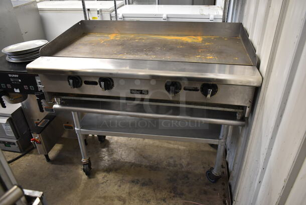Asber Stainless Steel Commercial Countertop Natural Gas Powered Flat Top Griddle on Stainless Steel Commercial Equipment Stand w/ Commercial Casters.