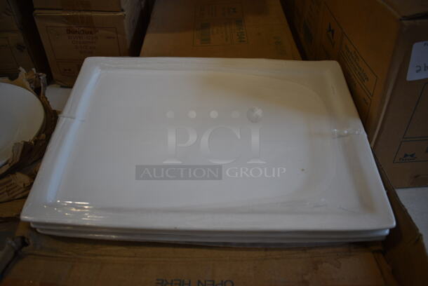 12 BRAND NEW IN BOX! Tuxton BWH-1544 White Ceramic Rectangular Plates. 15.75x11x1. 12 Times Your Bid!
