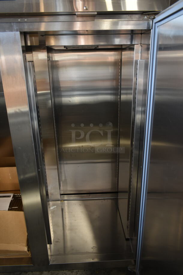 BRAND NEW SCRATCH AND DENT! 2022 Delfield GAHPT2-S Stainless Steel Commercial 2 Door Reach In Pass Through Warmer w/ Poly Coated Racks on Commercial Casters. 115 Volts, 1 Phase.  - Image 7 of 9