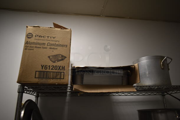 Metro Chrome Finish 4 Tier Wire Shelving Unit w/ Contents Including Metal Stock Pots on Commercial Casters. BUYER MUST REMOVE: BUYER MUST DISMANTLE. PCI CANNOT DISMANTLE FOR SHIPPING. PLEASE CONSIDER FREIGHT CHARGES. (kitchen) - Image 2 of 5