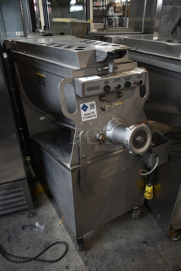 2011 Hobart MG2032 Metal Commercial Floor Style Electric Powered Meat Grinder w/ Foot Pedal on Commercial Casters. 208 Volts, 3 Phase.