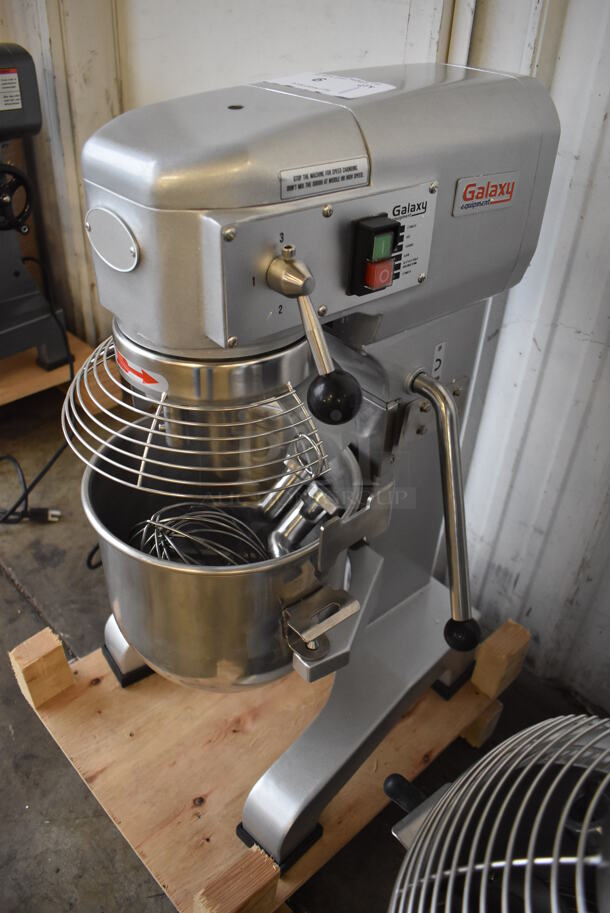 BRAND NEW SCRATCH AND DENT! Galaxy 177GMIX10 Metal Commercial Floor Style 10 Quart Planetary Dough Mixer w/ Stainless Steel Mixing Bowl, Bowl Guard, Dough Hook, Balloon Whisk and Paddle Attachments. 110 Volts, 1 Phase. 15x18x29. Tested and Working!